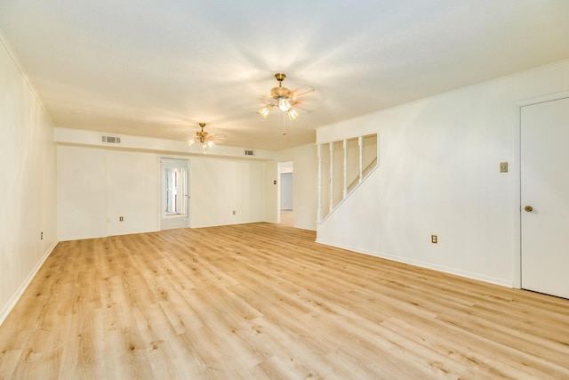 204 Caladium St, Lake Jackson, TX 77566 - empty room with stairs, light wood finished floors, ceiling fan, and baseboards
