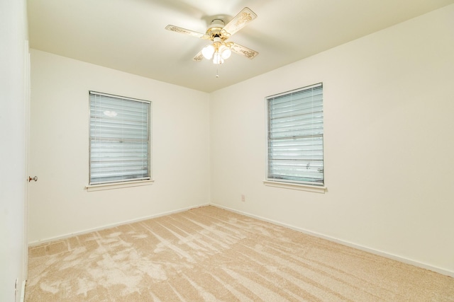 204 Caladium St, Lake Jackson, TX 77566 - spare room featuring light colored carpet, a ceiling fan, and baseboards