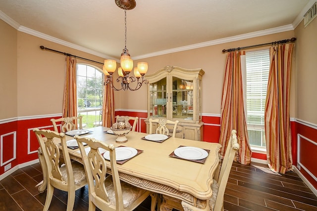 4214 Bridgestone Shadow Ct, Spring, TX 77388 - dining room featuring a chandelier, wainscoting, dark wood-style flooring, and crown molding