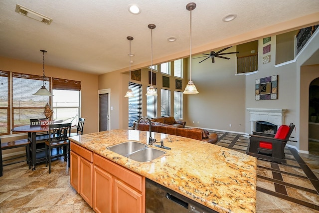 4214 Bridgestone Shadow Ct, Spring, TX 77388 - kitchen with a sink, open floor plan, a fireplace, ceiling fan, and recessed lighting