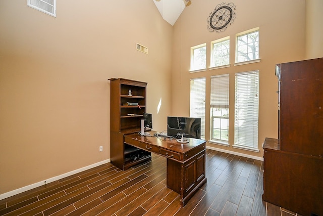 4214 Bridgestone Shadow Ct, Spring, TX 77388 - office space featuring baseboards, high vaulted ceiling, dark wood finished floors, and plenty of natural light