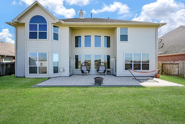 4214 Bridgestone Shadow Ct, Spring, TX 77388 - rear view of house featuring a patio, a chimney, and an outdoor fire pit