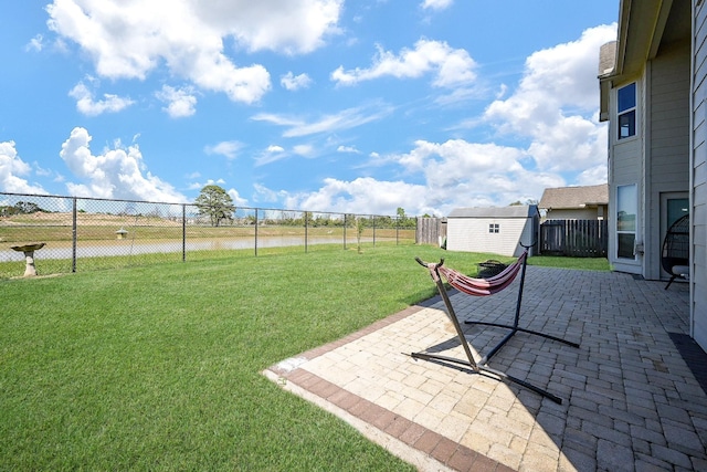 4214 Bridgestone Shadow Ct, Spring, TX 77388 - view of yard featuring a water view, a patio, and an outbuilding