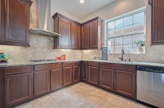 10002 Hutton Park Dr, Katy, TX 77494 - kitchen with stainless steel appliances, wall chimney exhaust hood, a sink, backsplash, and light stone counters