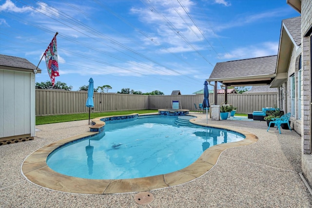 2206 E Van Trease Dr, Deer Park, TX 77536 - view of swimming pool featuring a fenced backyard, a pool with connected hot tub, and a patio area