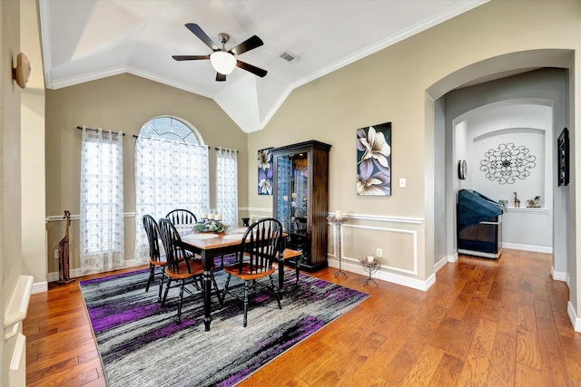 2206 E Van Trease Dr, Deer Park, TX 77536 - dining room with ceiling fan, wood finished floors, arched walkways, lofted ceiling, and ornamental molding