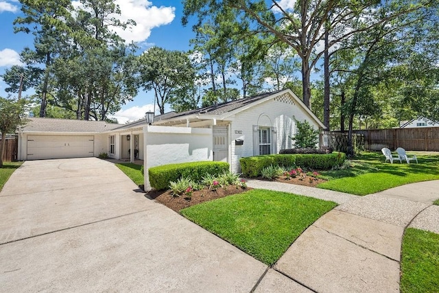 12302 Overcup Dr, Houston, TX 77024 - ranch-style home featuring driveway and an attached garage