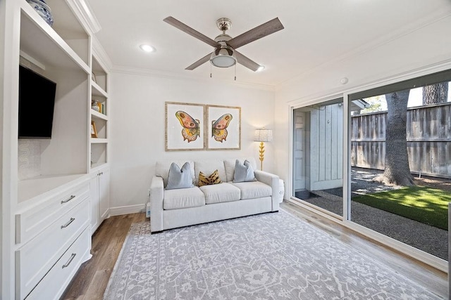 12302 Overcup Dr, Houston, TX 77024 - living room featuring wood finished floors, ornamental molding, a ceiling fan, and recessed lighting