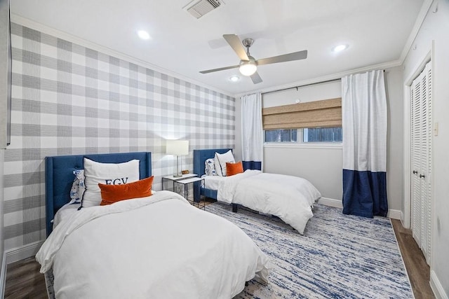 12302 Overcup Dr, Houston, TX 77024 - bedroom featuring ornamental molding, baseboards, wood finished floors, wallpapered walls, and a ceiling fan