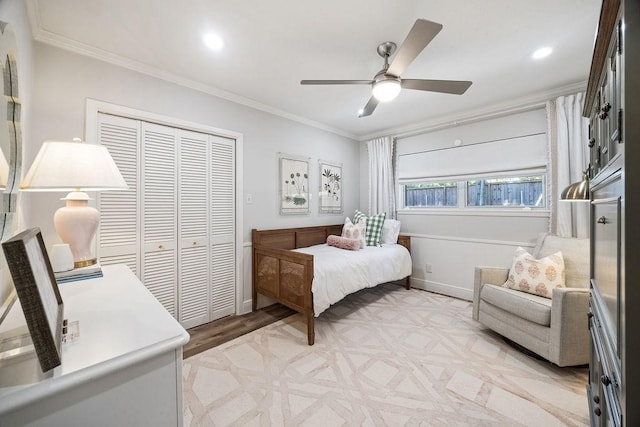 12302 Overcup Dr, Houston, TX 77024 - bedroom featuring ornamental molding, a closet, baseboards, light wood-style floors, and recessed lighting