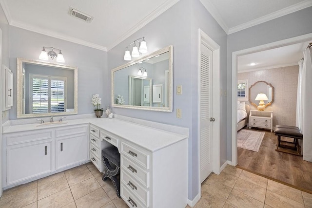 12302 Overcup Dr, Houston, TX 77024 - full bath featuring connected bathroom, ornamental molding, vanity, tile patterned flooring, and a closet