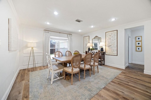 12302 Overcup Dr, Houston, TX 77024 - dining room featuring ornamental molding, wood finished floors, recessed lighting, and baseboards