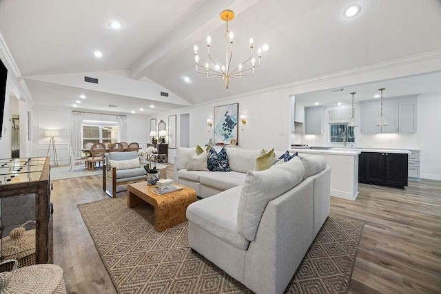 12302 Overcup Dr, Houston, TX 77024 - living room featuring light wood-type flooring, recessed lighting, a chandelier, and crown molding