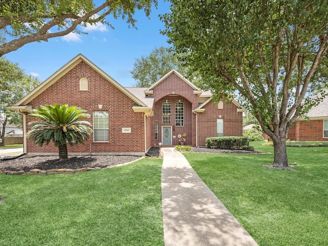 2710 Magnolia Walk, Spring, TX 77388 - traditional-style house with a front lawn and brick siding