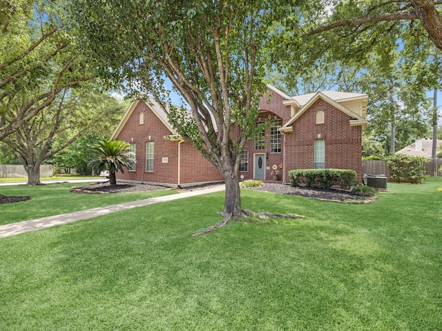 2710 Magnolia Walk, Spring, TX 77388 - traditional-style house featuring brick siding and central AC