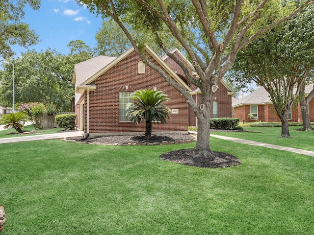 2710 Magnolia Walk, Spring, TX 77388 - view of front facade with a front yard and brick siding