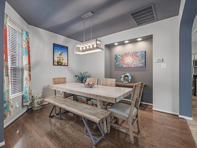 2710 Magnolia Walk, Spring, TX 77388 - dining space with baseboards, wood finished floors, and arched walkways