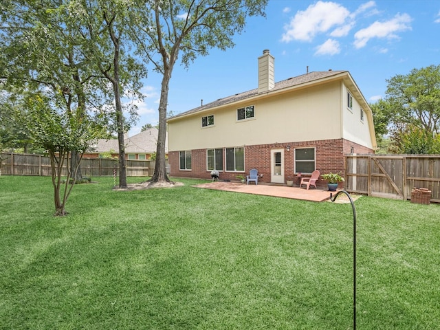 2710 Magnolia Walk, Spring, TX 77388 - back of house featuring brick siding, a patio, and a chimney
