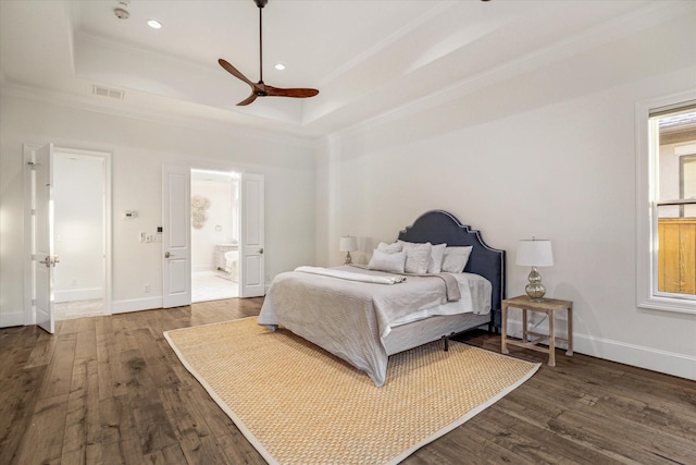 10 Broadwater Ct, Shenandoah, TX 77381 - bedroom featuring a tray ceiling, ornamental molding, wood finished floors, baseboards, and recessed lighting