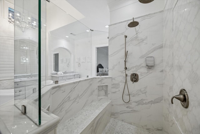 10 Broadwater Ct, Shenandoah, TX 77381 - full bath featuring a marble finish shower, crown molding, vanity, and tile walls