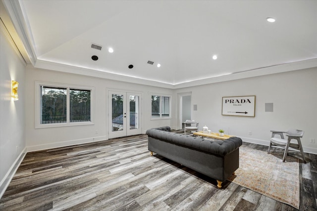 10 Broadwater Ct, Shenandoah, TX 77381 - living room with french doors, wood finished floors, a tray ceiling, recessed lighting, and baseboards