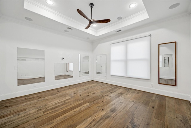 10 Broadwater Ct, Shenandoah, TX 77381 - unfurnished room featuring a raised ceiling, ornamental molding, a ceiling fan, hardwood / wood-style flooring, and baseboards