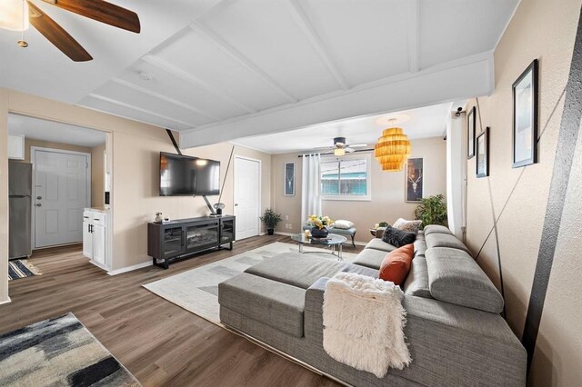 514 Texas, Surfside Beach, TX 77541 - living room with ceiling fan, wood finished floors, and beamed ceiling