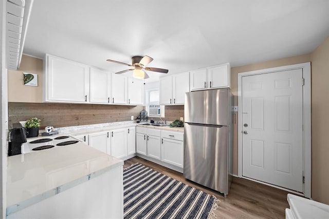 514 Texas, Surfside Beach, TX 77541 - kitchen with freestanding refrigerator, a ceiling fan, light countertops, and white cabinetry