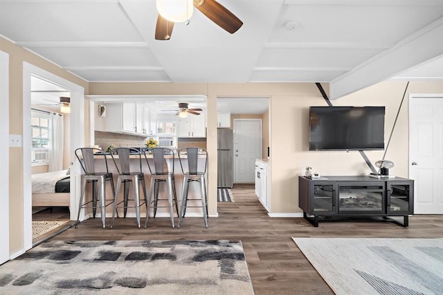 514 Texas, Surfside Beach, TX 77541 - living area featuring a ceiling fan and wood finished floors