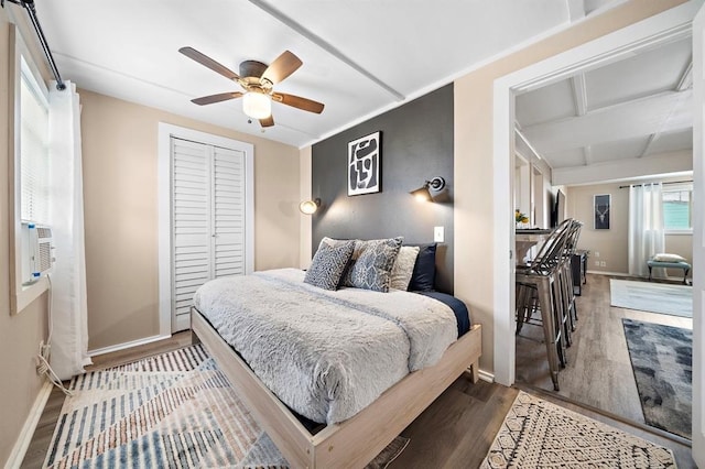 514 Texas, Surfside Beach, TX 77541 - bedroom with wood finished floors, a closet, and a ceiling fan