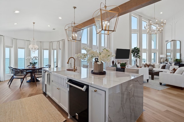 102 Lanai St, Tiki Island, TX 77554 - kitchen featuring a chandelier, dishwashing machine, high vaulted ceiling, healthy amount of natural light, and open floor plan