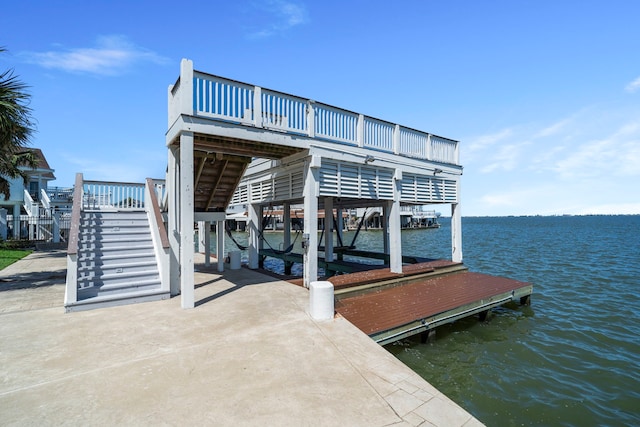 102 Lanai St, Tiki Island, TX 77554 - dock area featuring a water view, stairway, and boat lift
