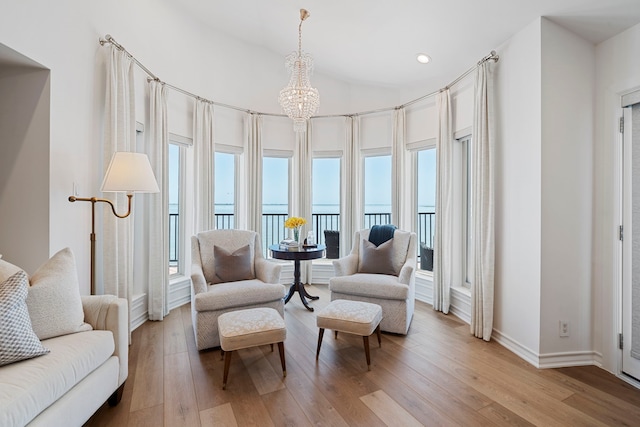 102 Lanai St, Tiki Island, TX 77554 - sitting room featuring plenty of natural light, light wood-style flooring, a chandelier, and recessed lighting