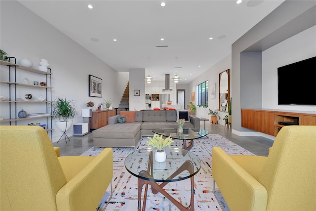 1136 Aurora St, Houston, TX 77009 - living room with recessed lighting, stairs, and finished concrete floors