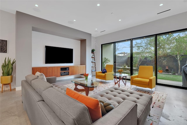 1136 Aurora St, Houston, TX 77009 - living room featuring concrete flooring and recessed lighting