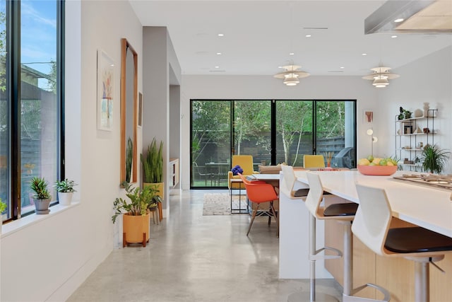 1136 Aurora St, Houston, TX 77009 - dining space featuring finished concrete flooring and recessed lighting