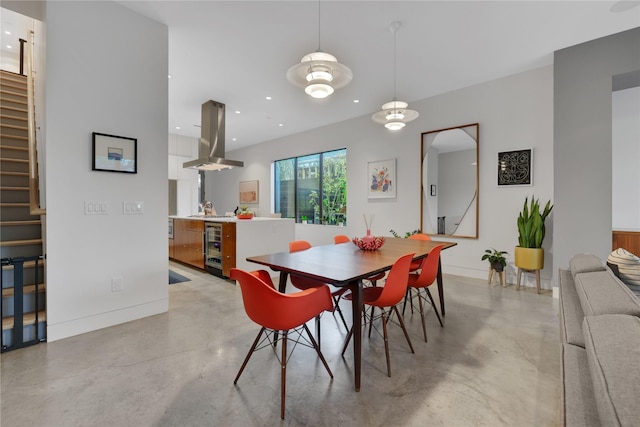1136 Aurora St, Houston, TX 77009 - dining room featuring concrete flooring, stairway, recessed lighting, baseboards, and wine cooler