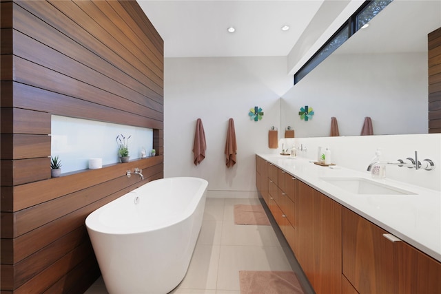 1136 Aurora St, Houston, TX 77009 - full bath with double vanity, a soaking tub, tile patterned flooring, baseboards, and recessed lighting