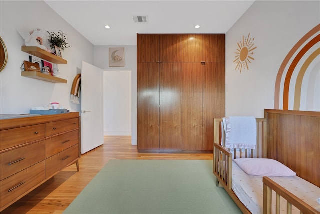 1136 Aurora St, Houston, TX 77009 - bedroom with light wood-style floors and recessed lighting