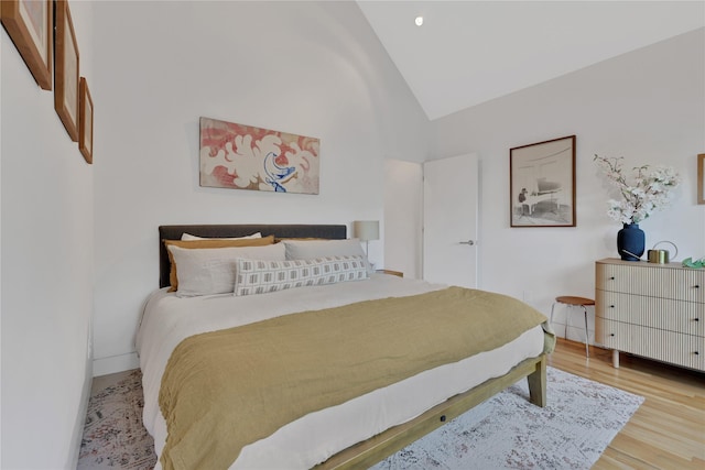 1136 Aurora St, Houston, TX 77009 - bedroom with wood finished floors and high vaulted ceiling