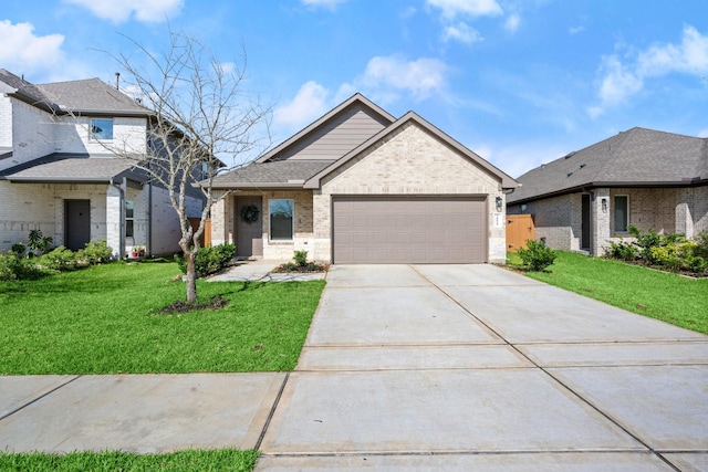 20010 Sienna Green Dr, Hockley, TX 77447 - view of front facade featuring brick siding, a front yard, driveway, and an attached garage