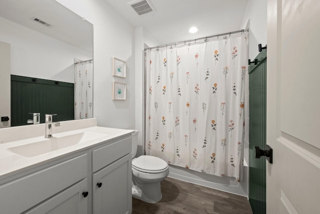 20010 Sienna Green Dr, Hockley, TX 77447 - bathroom with wood finished floors, vanity, toilet, and shower / bathtub combination with curtain