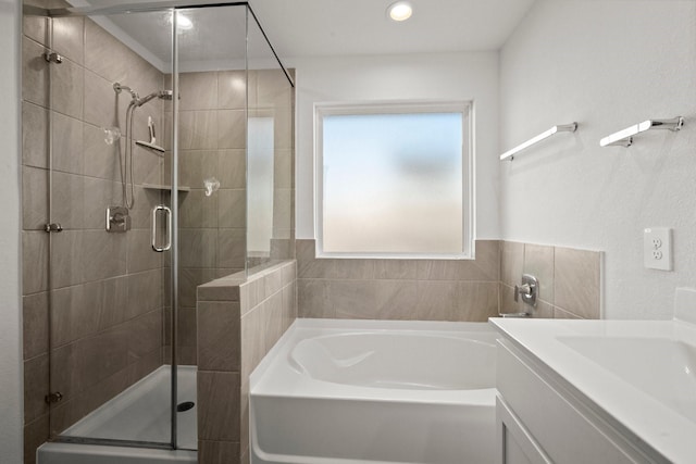 20010 Sienna Green Dr, Hockley, TX 77447 - full bathroom with a garden tub, a stall shower, vanity, and recessed lighting