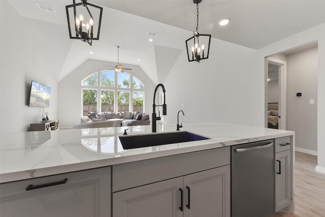 5107 Shimmering Brook Ln, Fulshear, TX 77441 - kitchen featuring a sink, stainless steel dishwasher, a chandelier, a ceiling fan, and vaulted ceiling