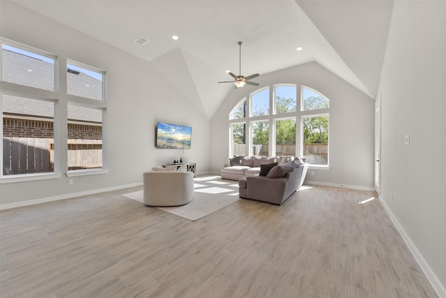 5107 Shimmering Brook Ln, Fulshear, TX 77441 - living area featuring ceiling fan, light wood-style flooring, baseboards, and lofted ceiling