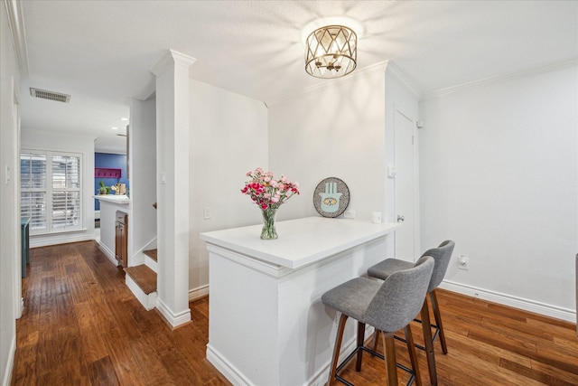 2513 Bering Dr Unit 13, Houston, TX 77057 - corridor with crown molding, wood finished floors, a chandelier, and baseboards