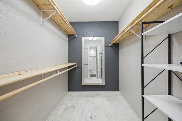 2513 Bering Dr Unit 13, Houston, TX 77057 - spacious closet with light marble finish flooring
