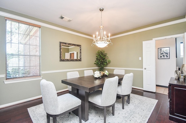 31 Hope Farm Rd, Missouri City, TX 77459 - dining space featuring a chandelier, healthy amount of natural light, dark wood-style floors, baseboards, and crown molding