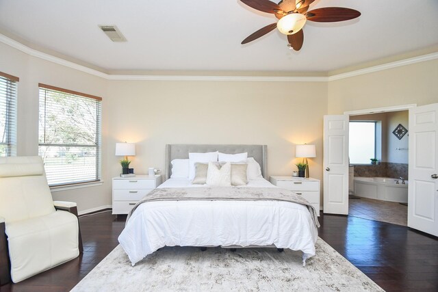 31 Hope Farm Rd, Missouri City, TX 77459 - bedroom featuring crown molding, dark wood-type flooring, connected bathroom, a ceiling fan, and baseboards