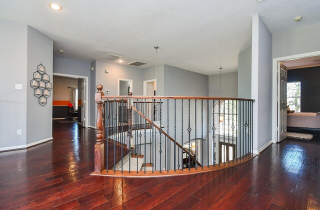 31 Hope Farm Rd, Missouri City, TX 77459 - hallway featuring wood finished floors, an upstairs landing, baseboards, and recessed lighting
